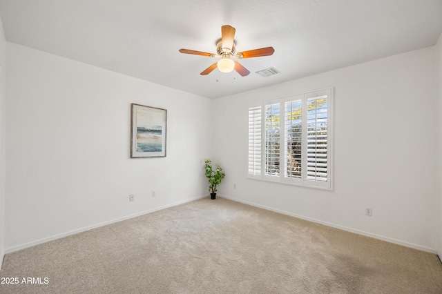 empty room with light carpet and ceiling fan