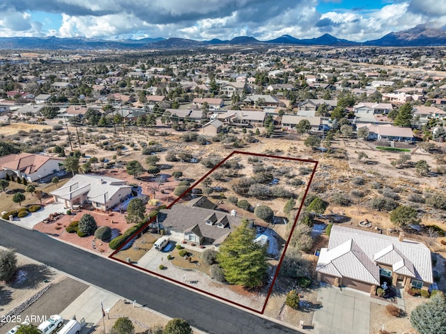 birds eye view of property featuring a mountain view