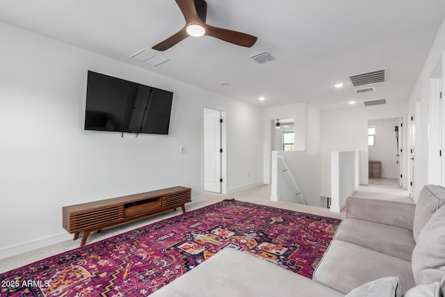 8640 W Frier Dr, Glendale, AZ 85305 - living room with ceiling fan, recessed lighting, light colored carpet, and baseboards