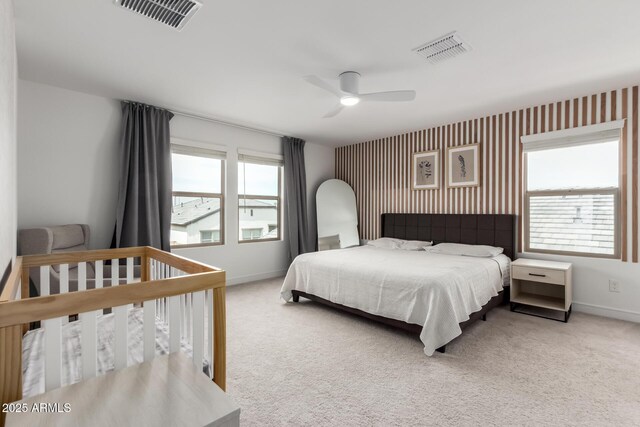 8640 W Frier Dr, Glendale, AZ 85305 - carpeted bedroom featuring baseboards, wallpapered walls, and ceiling fan