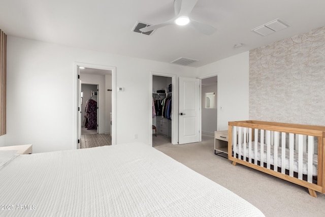 8640 W Frier Dr, Glendale, AZ 85305 - bedroom featuring carpet floors, a closet, ceiling fan, and a spacious closet