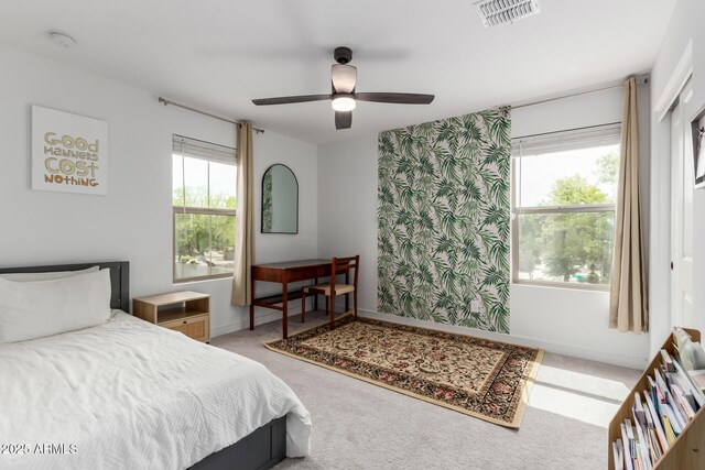 8640 W Frier Dr, Glendale, AZ 85305 - bedroom featuring light colored carpet, baseboards, and ceiling fan