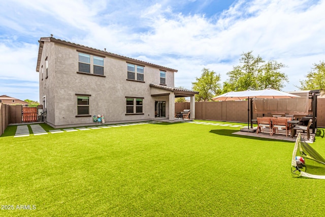 8640 W Frier Dr, Glendale, AZ 85305 - rear view of house with a patio and stucco siding