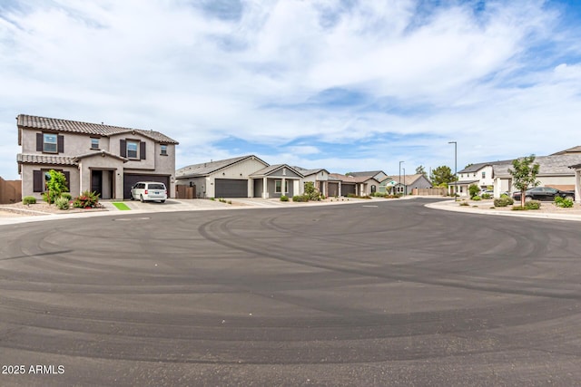 8640 W Frier Dr, Glendale, AZ 85305 - view of asphalt road featuring a residential view and street lights