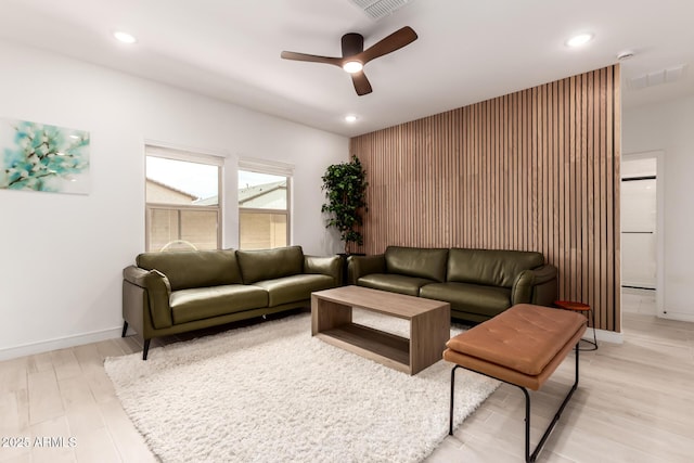 8640 W Frier Dr, Glendale, AZ 85305 - living room featuring a ceiling fan, recessed lighting, light wood-style flooring, and baseboards