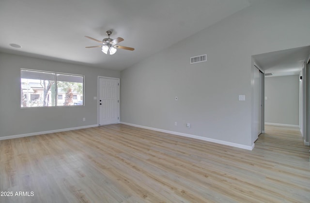 unfurnished living room featuring visible vents, a ceiling fan, light wood-style floors, and lofted ceiling