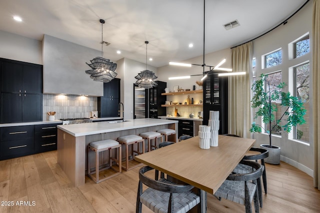 dining space with visible vents, recessed lighting, and light wood-type flooring