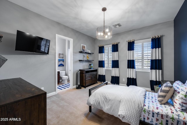 carpeted bedroom featuring a chandelier, visible vents, ensuite bathroom, and baseboards