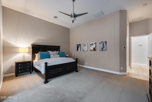 carpeted bedroom featuring visible vents and baseboards