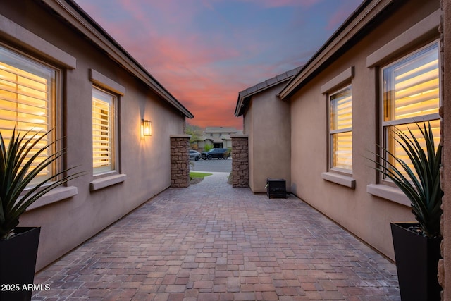 view of patio terrace at dusk