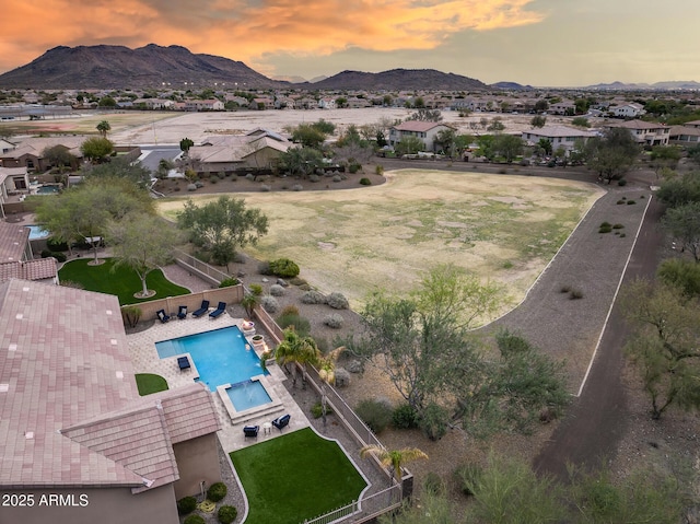 aerial view at dusk with a mountain view