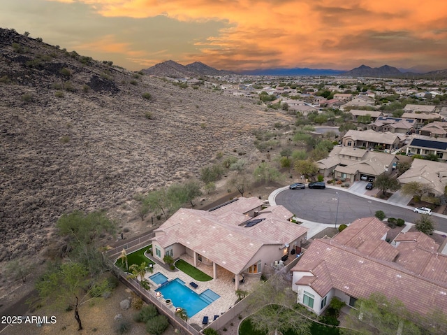 birds eye view of property with a residential view and a mountain view