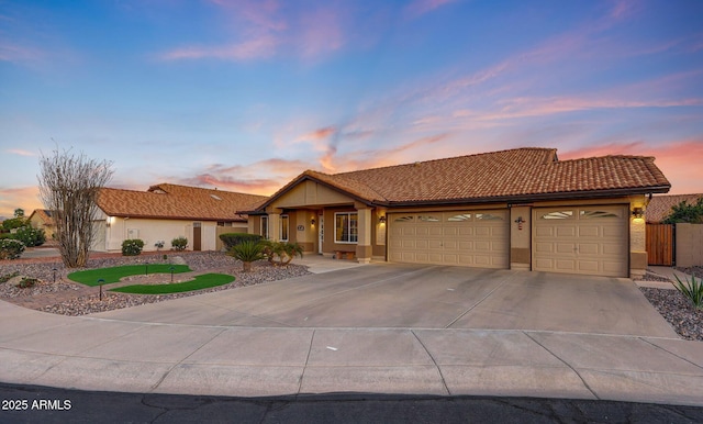 11047 W Irma Ln, Peoria, AZ 85373 - ranch-style home featuring driveway, a tile roof, a garage, and stucco siding