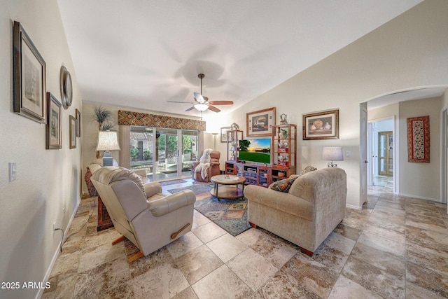 11047 W Irma Ln, Peoria, AZ 85373 - living area with baseboards, vaulted ceiling, arched walkways, and ceiling fan