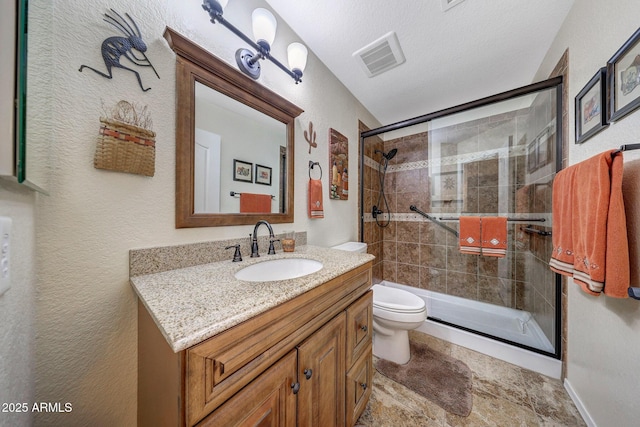11047 W Irma Ln, Peoria, AZ 85373 - bathroom featuring toilet, vanity, a stall shower, and visible vents