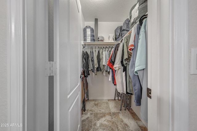 11047 W Irma Ln, Peoria, AZ 85373 - walk in closet with stone finish flooring