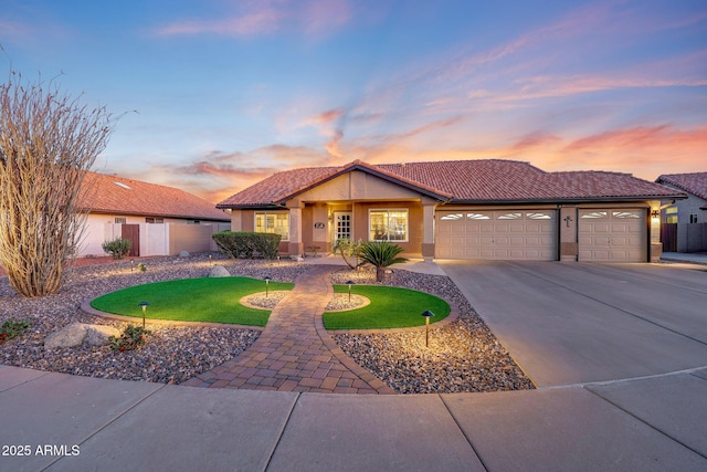 11047 W Irma Ln, Peoria, AZ 85373 - view of front of property featuring a tile roof, stucco siding, fence, an attached garage, and driveway