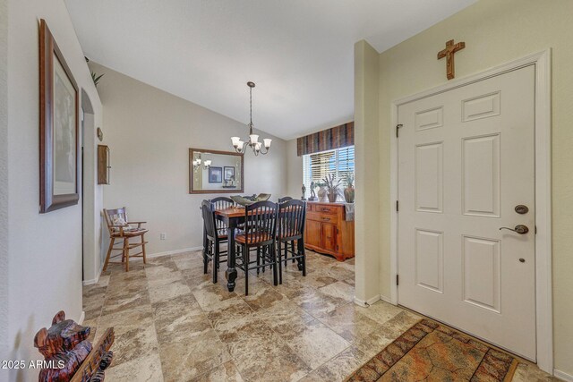 11047 W Irma Ln, Peoria, AZ 85373 - dining area with baseboards, a notable chandelier, and vaulted ceiling