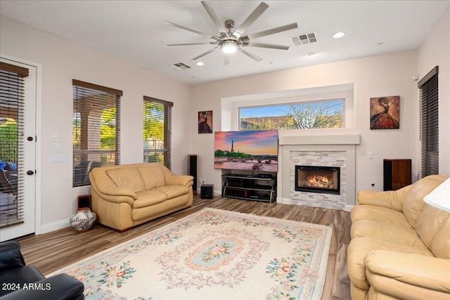 living room with visible vents, wood finished floors, and recessed lighting