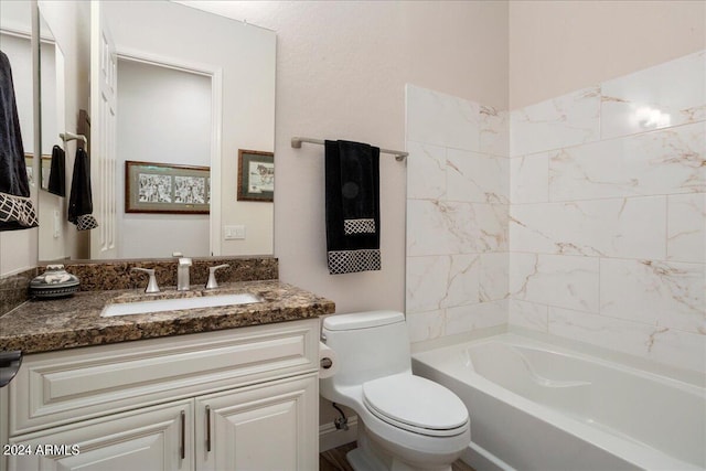 bathroom with shower / tub combination, vanity, and toilet