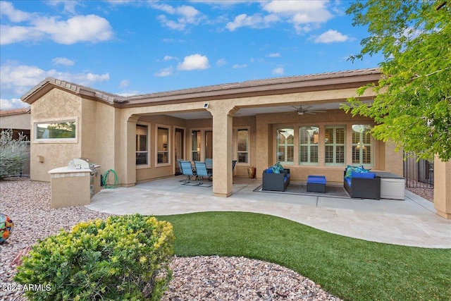 rear view of house featuring stucco siding, an outdoor hangout area, a ceiling fan, and a patio