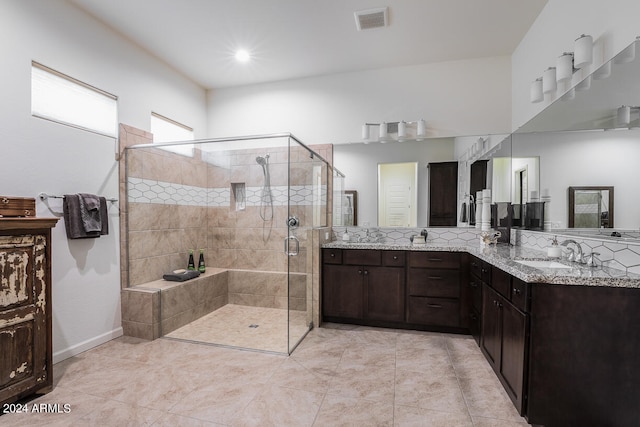 bathroom featuring vanity, tile patterned flooring, and an enclosed shower