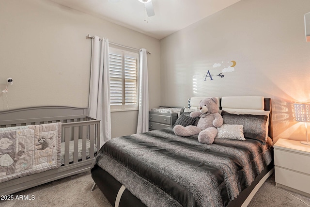 bedroom featuring ceiling fan and light colored carpet