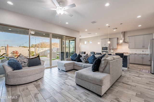 living room featuring ceiling fan