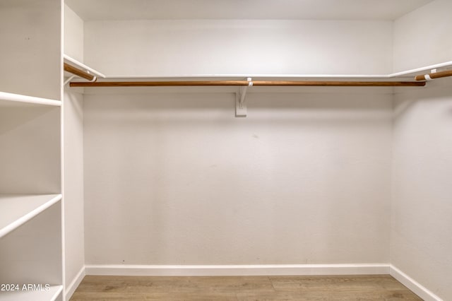 walk in closet featuring hardwood / wood-style flooring