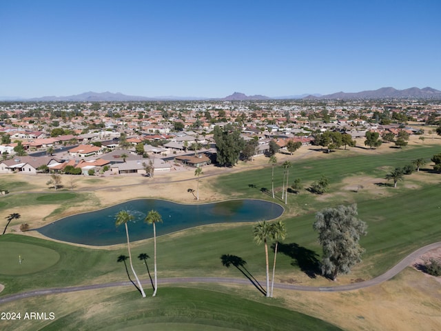 birds eye view of property with a water and mountain view