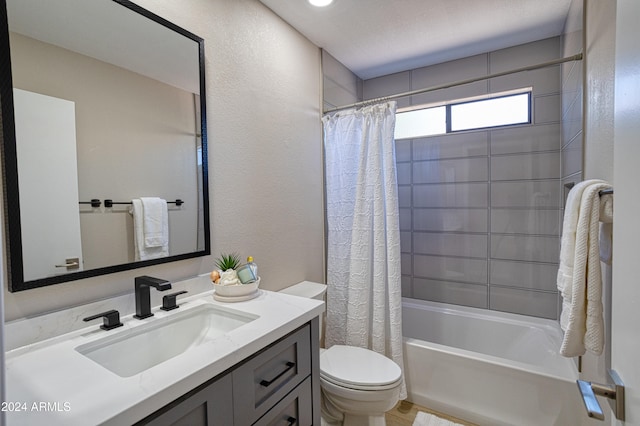 full bathroom with shower / bath combo, vanity, and toilet