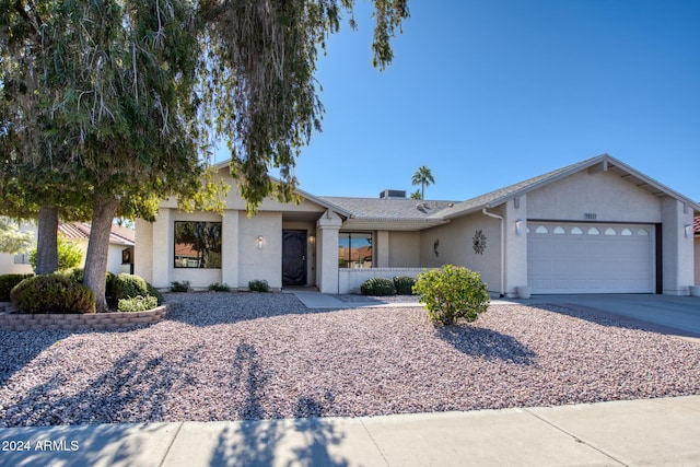 ranch-style home with a garage