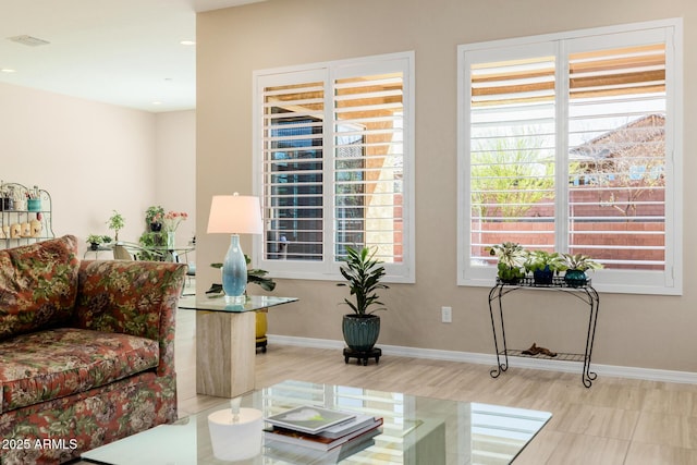 living room featuring wood finished floors, baseboards, and recessed lighting