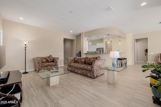 living room with visible vents, baseboards, recessed lighting, and light tile patterned flooring