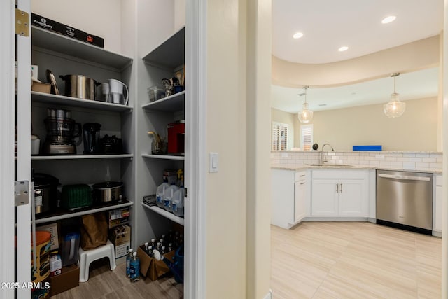 pantry featuring a sink