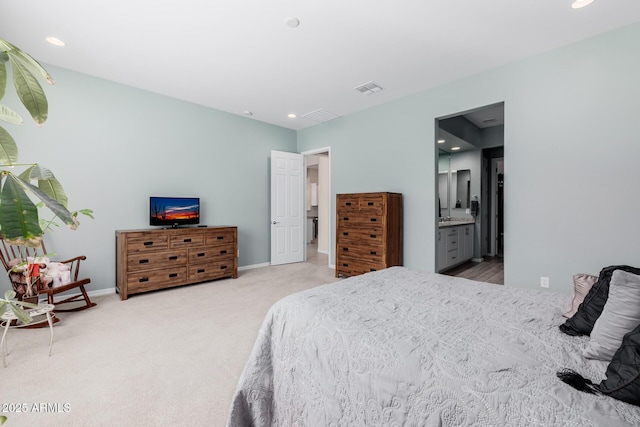 carpeted bedroom with visible vents, baseboards, recessed lighting, and connected bathroom