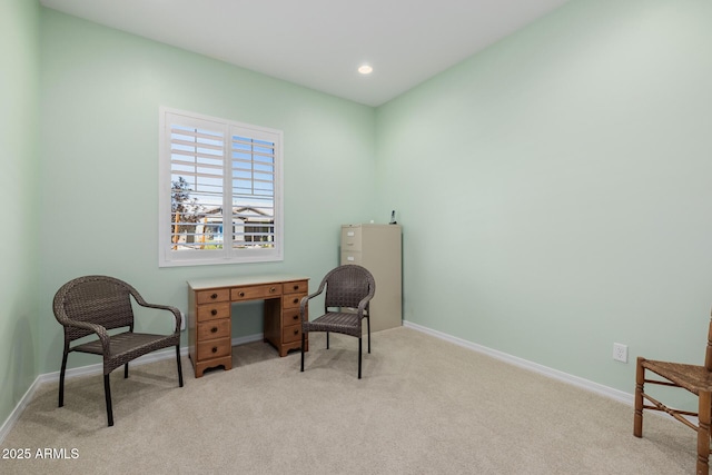 living area featuring light carpet, recessed lighting, and baseboards
