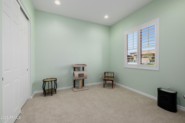living area with recessed lighting, baseboards, and carpet floors