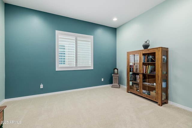 interior space featuring baseboards, recessed lighting, and carpet flooring