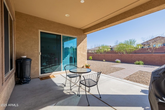 view of patio / terrace featuring outdoor dining area and a fenced backyard