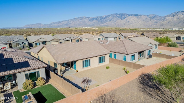aerial view featuring a mountain view and a residential view