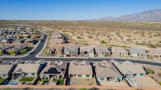 birds eye view of property with a mountain view and a residential view
