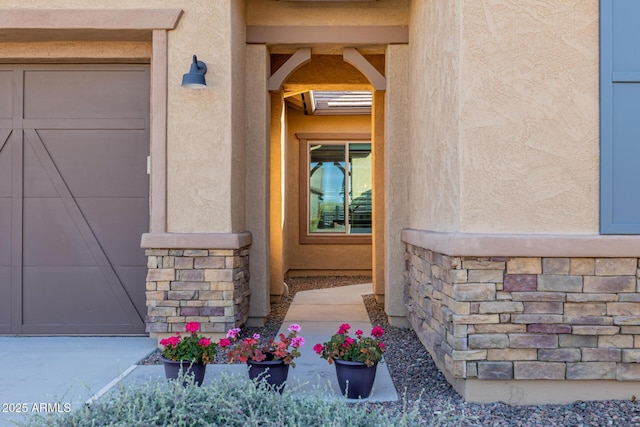 entrance to property featuring stucco siding and stone siding