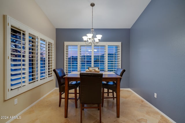 dining space with an inviting chandelier