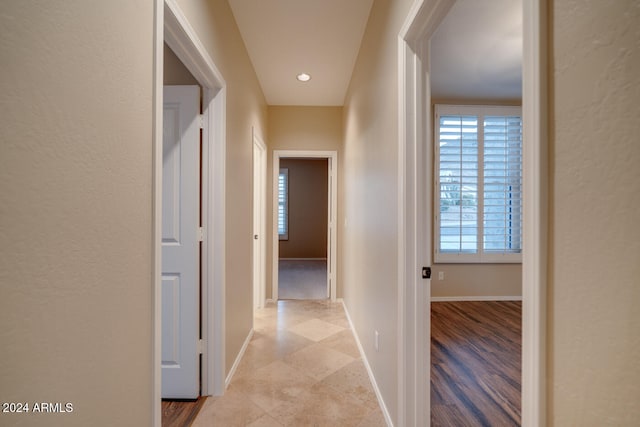 hall with light hardwood / wood-style flooring