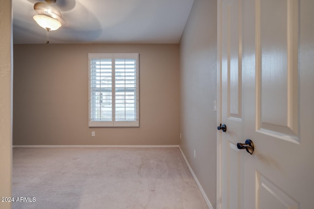 empty room with light colored carpet