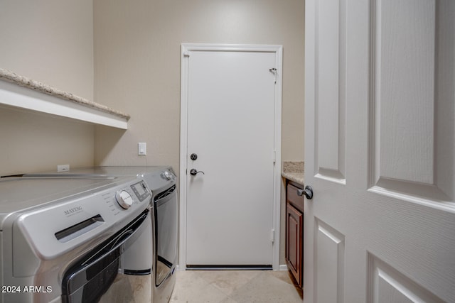 laundry room featuring washer and clothes dryer