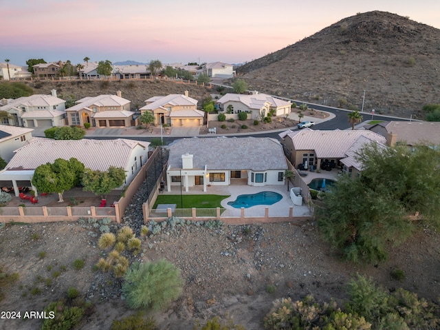 aerial view at dusk with a mountain view