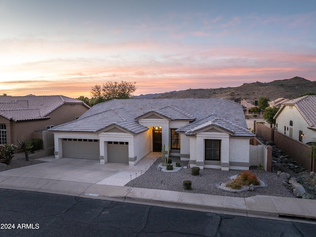 view of front of house featuring a mountain view and a garage