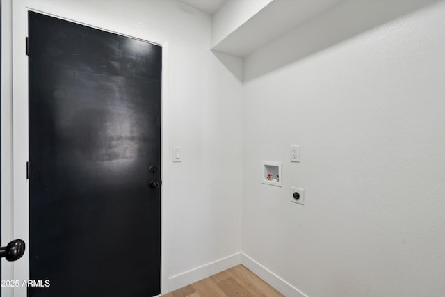 washroom featuring hookup for a washing machine, hookup for an electric dryer, laundry area, baseboards, and light wood-type flooring